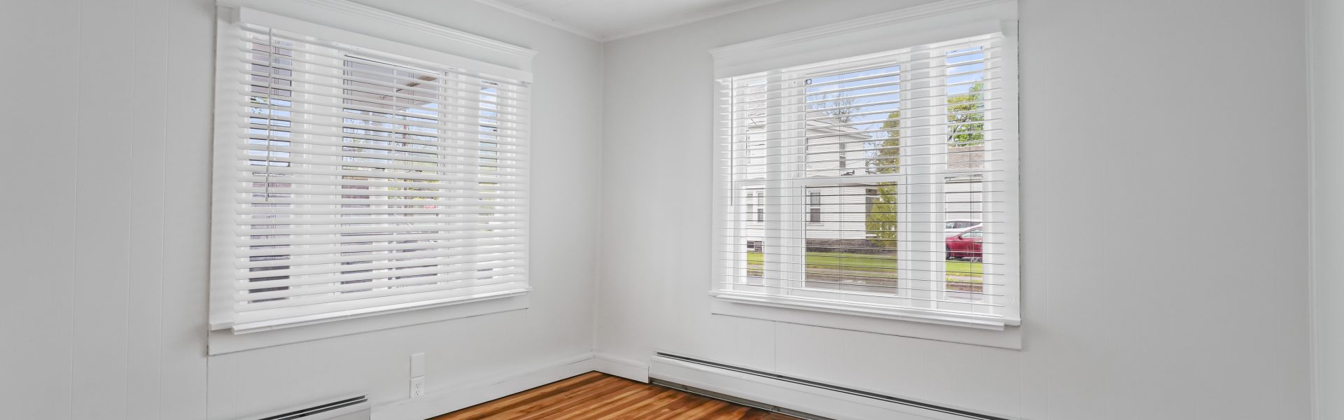 Interior view of a newly renovated 1-bedroom apartment at 2 New St #3 in South Glens Falls, NY with updated flooring and modern finishes.