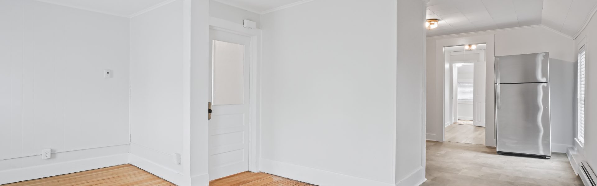 Interior view of a newly renovated 1-bedroom apartment at 2 New St #4 in South Glens Falls, NY, featuring updated flooring, modern finishes, and bright natural light.