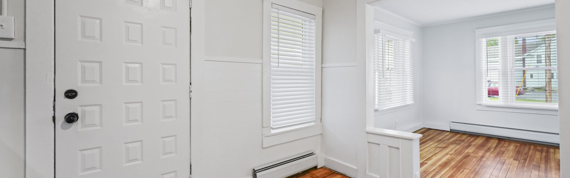 Interior view of a newly renovated 1-bedroom apartment at 2 New St #3 in South Glens Falls, NY with updated flooring and modern finishes.