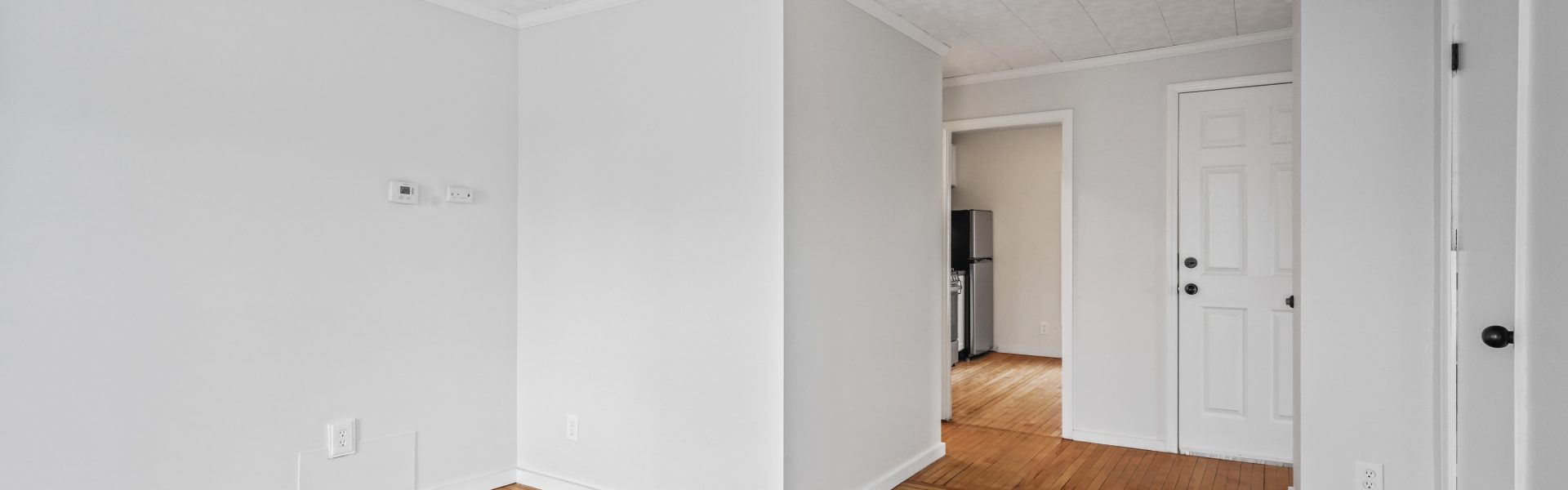 Interior view of a newly renovated 1-bedroom apartment at 35 Saratoga Ave #1 in South Glens Falls, NY, featuring modern finishes and bright natural light.
