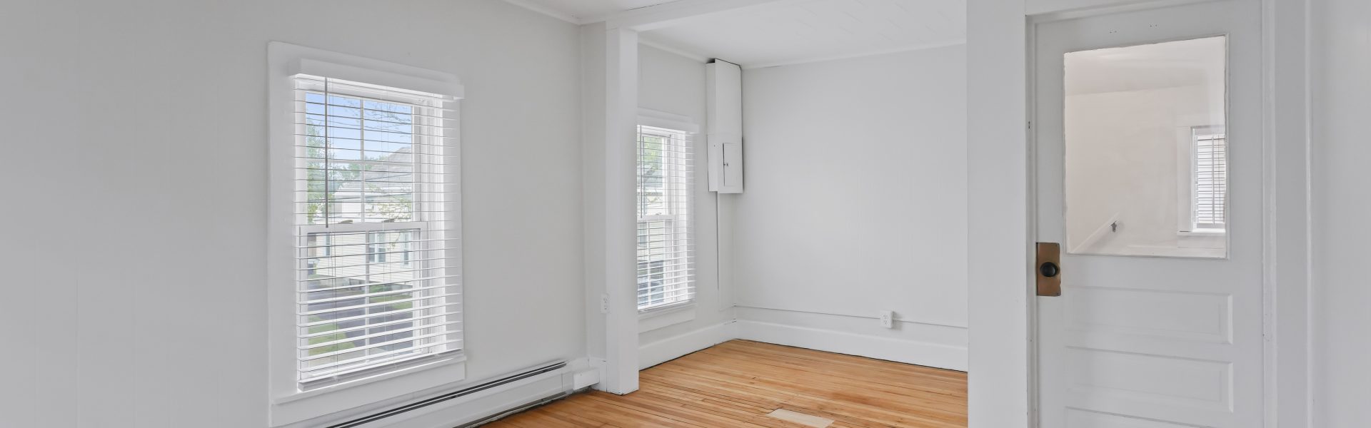 Interior view of a newly renovated 1-bedroom apartment at 2 New St #4 in South Glens Falls, NY, featuring updated flooring, modern finishes, and bright natural light.