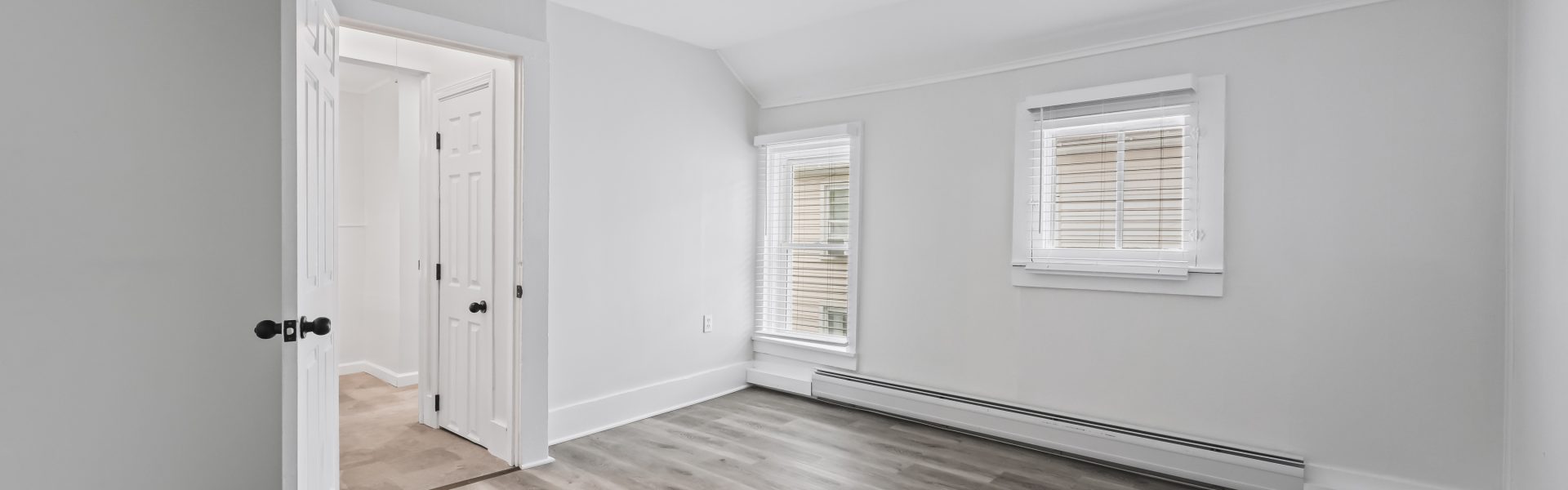 Interior view of a newly renovated 1-bedroom apartment at 2 New St #4 in South Glens Falls, NY, featuring updated flooring, modern finishes, and bright natural light.