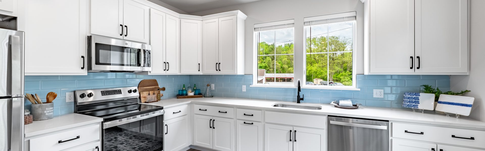Modern kitchen at The Ridge featuring stainless steel appliances and updated cabinetry
